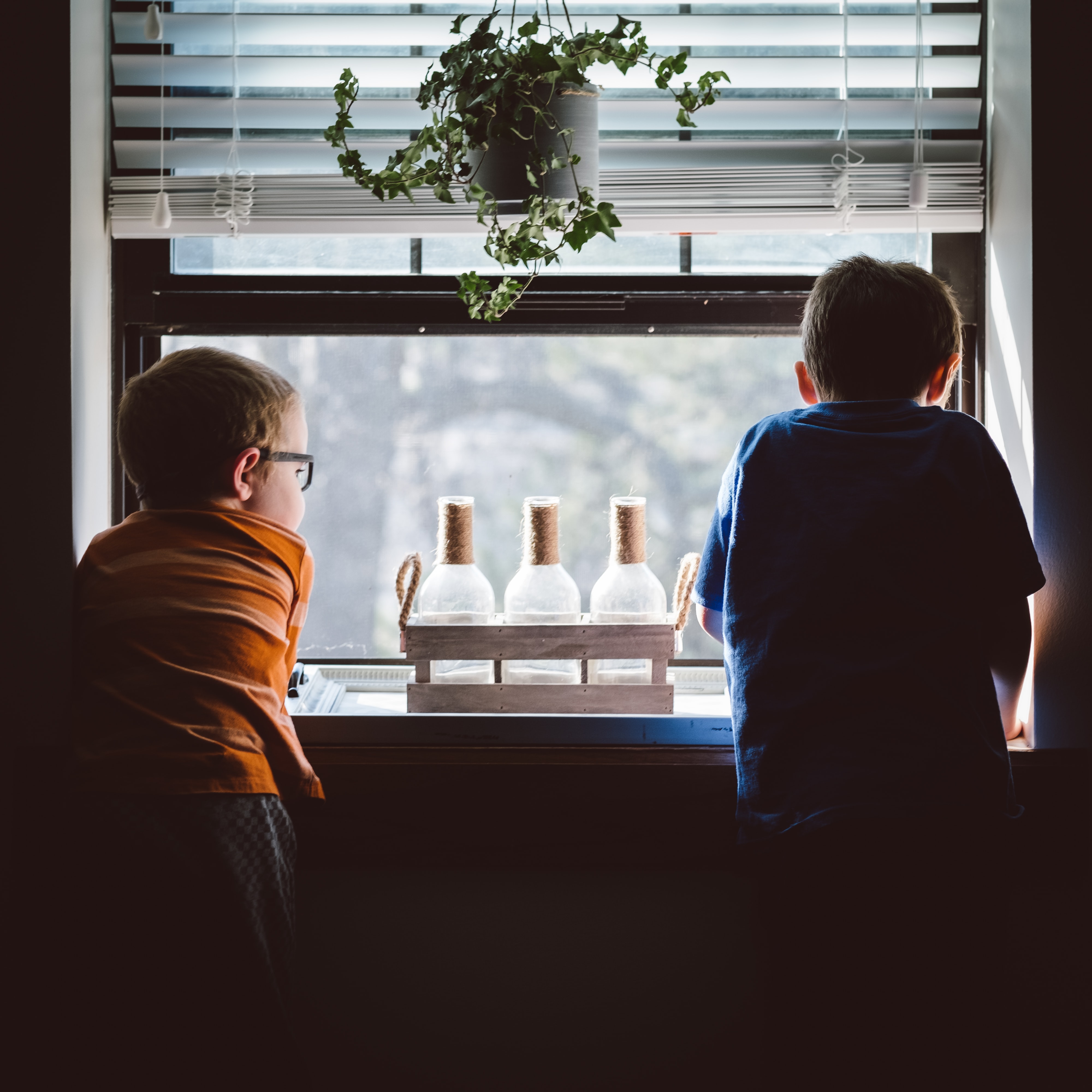 children at window - window coverings