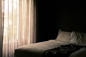 window shades help make a bedroom more cozy